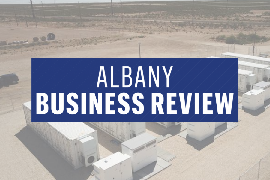Albany Business Review logo with storage site behind it.
