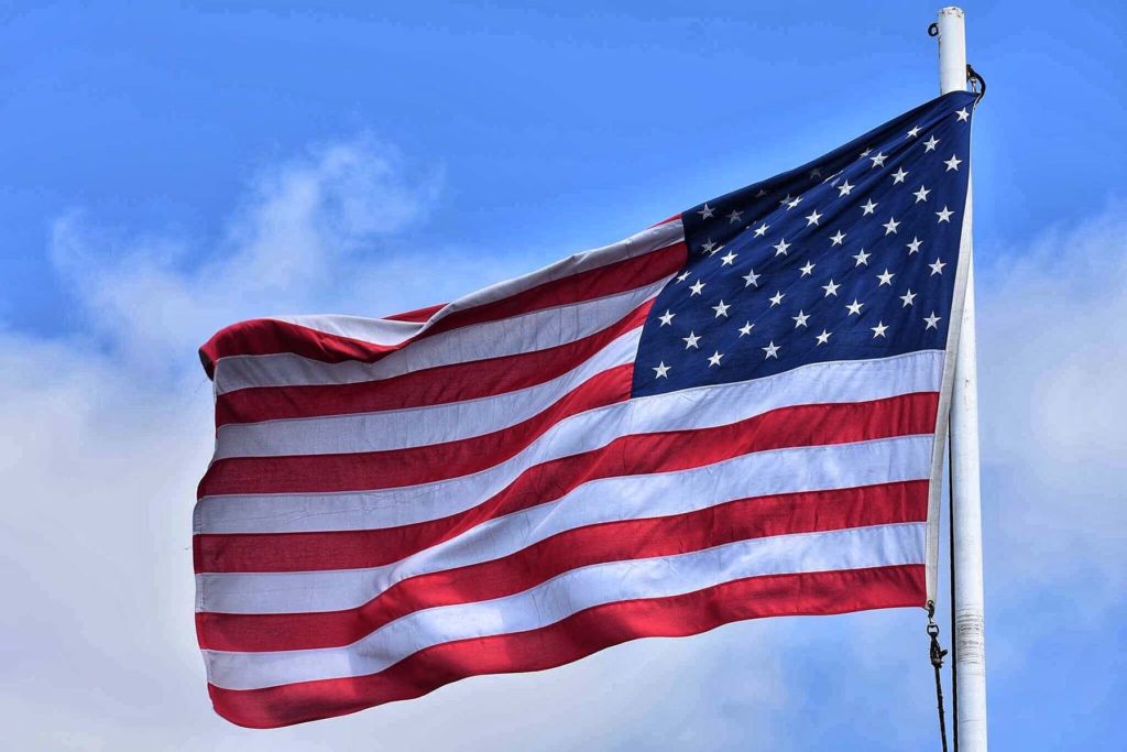 American flag flying on a flag pole.