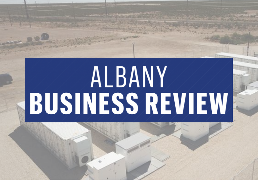 Albany Business Review logo with storage site behind it.