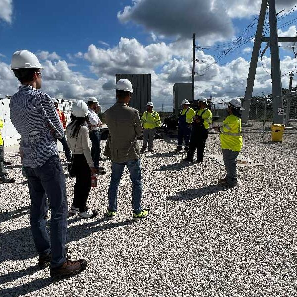 Group of construction workers meeting at construction site.