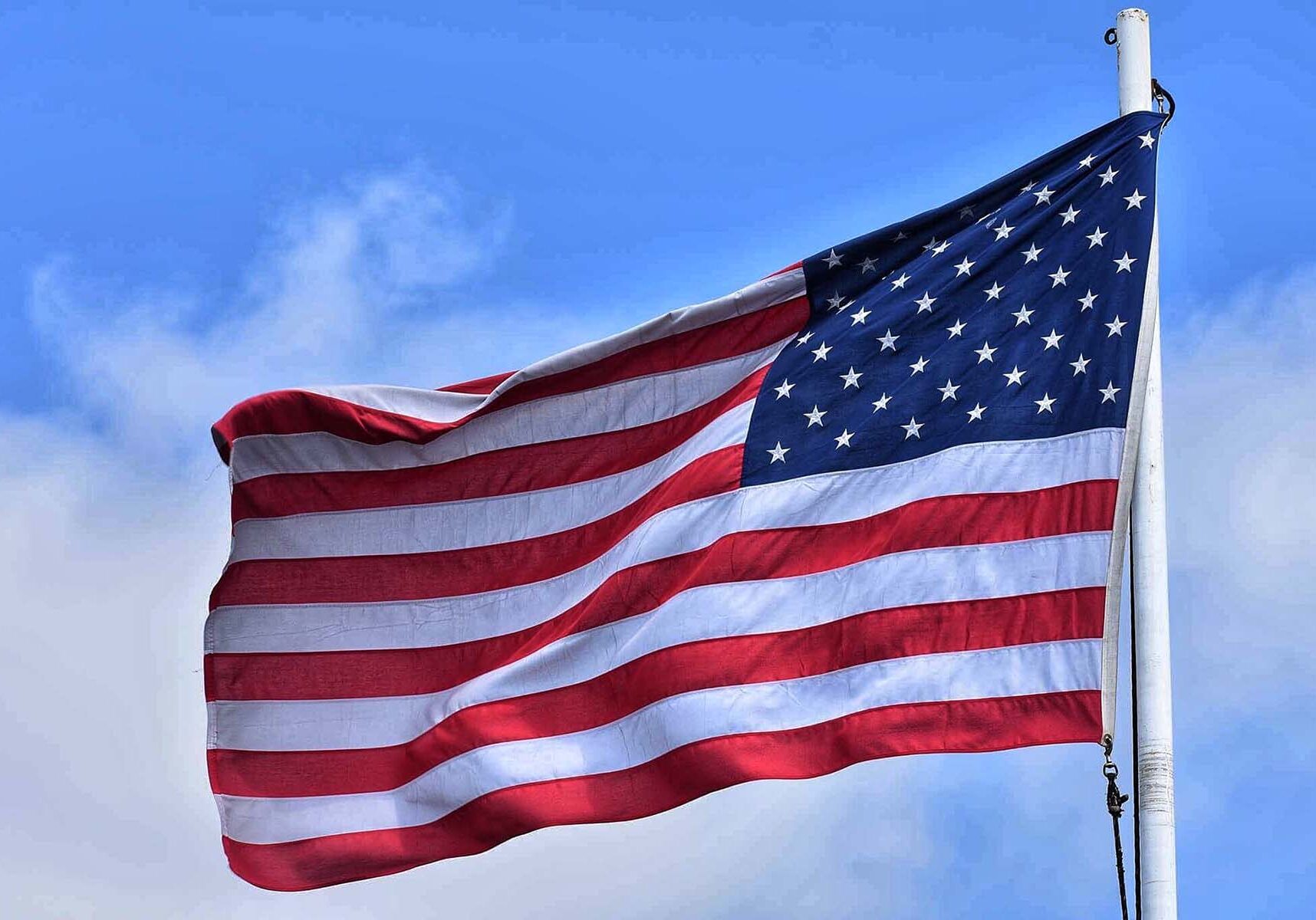 American flag flying on a flag pole.